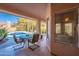 Charming patio featuring a cozy dining setup, perfect for enjoying outdoor meals with a view of the refreshing pool at 4628 E Gelding Dr, Phoenix, AZ 85032