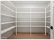 Bright, walk-in pantry featuring white walls, bright lighting, and white shelving at 5000 N Camelback Ridge Dr # 203, Scottsdale, AZ 85251
