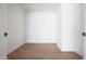 Neutral room featuring hardwood floors, white walls, white trim and interior doors at 5000 N Camelback Ridge Dr # 203, Scottsdale, AZ 85251
