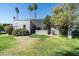 Charming home with a lush backyard, mature trees, and a covered patio, creating a private oasis at 5642 N Scottsdale Rd, Paradise Valley, AZ 85253