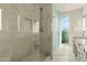 Modern bathroom features a glass enclosed shower, white vanity, and large mirror at 5642 N Scottsdale Rd, Paradise Valley, AZ 85253