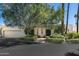 Charming single-story home with mature trees and a well-manicured front yard at 5642 N Scottsdale Rd, Paradise Valley, AZ 85253