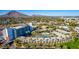 Stunning aerial view of a hotel surrounded by palm trees, landscaping, and desert mountains in Scottsdale, Arizona at 6850 E Main St # 4416, Scottsdale, AZ 85251