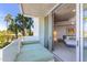 Serene balcony with daybed, palm tree views, and open access to the bedroom at 6850 E Main St # 4416, Scottsdale, AZ 85251