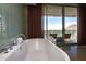 Bright bathroom features a modern soaking tub and a balcony with mountain views at 6850 E Main St # 4416, Scottsdale, AZ 85251