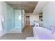 Bright bathroom features a modern soaking tub, glass-enclosed shower, and double vanity sinks at 6850 E Main St # 4416, Scottsdale, AZ 85251