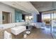 Bright bathroom features a modern soaking tub, glass-enclosed shower, and double vanity sinks at 6850 E Main St # 4416, Scottsdale, AZ 85251