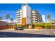 Exterior shot of a multi-story building with palm trees and desert landscaping at 6850 E Main St # 4416, Scottsdale, AZ 85251