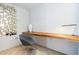 Sleek home office features a built-in wooden desk, stylish chair, and unique mirrored wall decor at 6850 E Main St # 4416, Scottsdale, AZ 85251