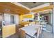 Bright, modern kitchen with custom yellow cabinets and a large kitchen island at 6850 E Main St # 4416, Scottsdale, AZ 85251