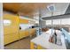 Bright, open kitchen with yellow cabinets and stainless steel appliances providing a stylish cooking space at 6850 E Main St # 4416, Scottsdale, AZ 85251