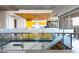 Open concept living area with views of the modern kitchen and staircase at 6850 E Main St # 4416, Scottsdale, AZ 85251