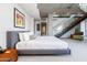 Comfortable main bedroom featuring a king-size bed, concrete ceilings, and modern décor at 6850 E Main St # 4416, Scottsdale, AZ 85251