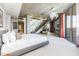 Bright and airy main bedroom with a staircase, modern lighting, and laundry room access at 6850 E Main St # 4416, Scottsdale, AZ 85251