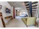 Large main bedroom with modern decor, a staircase, and a view of the city at 6850 E Main St # 4416, Scottsdale, AZ 85251
