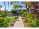Inviting backyard pool area surrounded by lush landscaping and a paved walkway at 6850 E Main St # 4416, Scottsdale, AZ 85251