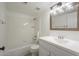 Bathroom features a bathtub with a shower and a white vanity with mirror at 6885 E Cochise Rd # 219, Paradise Valley, AZ 85253