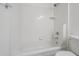 Full bathroom with a white tiled bathtub and toilet at 6885 E Cochise Rd # 219, Paradise Valley, AZ 85253