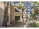 Exterior shot of a multi-Gathering home with beige siding, stairs and mature trees at 6885 E Cochise Rd # 219, Paradise Valley, AZ 85253