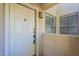 Close-up view of the white front door of the condominium unit number 219 at 6885 E Cochise Rd # 219, Paradise Valley, AZ 85253