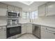 Bright kitchen with stainless steel appliances at 6885 E Cochise Rd # 219, Paradise Valley, AZ 85253