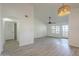 Open-concept living area with modern flooring, neutral walls, and a ceiling fan at 6885 E Cochise Rd # 219, Paradise Valley, AZ 85253