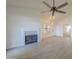 Living room with fireplace, windows, and a ceiling fan at 6885 E Cochise Rd # 219, Paradise Valley, AZ 85253