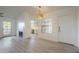 Open living space featuring modern flooring, a fireplace, and natural light at 6885 E Cochise Rd # 219, Paradise Valley, AZ 85253