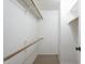 Walk-in closet with wire shelving and carpeted floor provides efficient storage at 6885 E Cochise Rd # 219, Paradise Valley, AZ 85253