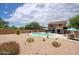 Spacious backyard with a pool, patio area, and desert landscaping at 7511 E Desert Vista Rd, Scottsdale, AZ 85255