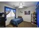 Bedroom featuring a twin bed, comic character curtains, and super hero decor at 7511 E Desert Vista Rd, Scottsdale, AZ 85255