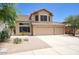 Two-story home featuring a three-car garage and desert landscaping at 7511 E Desert Vista Rd, Scottsdale, AZ 85255