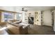 Spacious living room featuring custom built-ins and a ceiling fan at 7511 E Desert Vista Rd, Scottsdale, AZ 85255