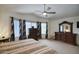 Spacious main bedroom with ceiling fan, large dresser, and bay window at 7511 E Desert Vista Rd, Scottsdale, AZ 85255