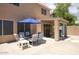 Outdoor patio with seating area and partial shade for entertaining at 7511 E Desert Vista Rd, Scottsdale, AZ 85255