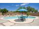 Backyard pool features a table and umbrella for outdoor relaxation at 7511 E Desert Vista Rd, Scottsdale, AZ 85255