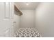 Walk-in closet with decorative tiled floor and a single shelf for storage at 7920 E Camelback Rd # 408, Scottsdale, AZ 85251