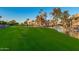 Beautiful grassy space with a serene pond running along the edge of the complex at 7920 E Camelback Rd # 408, Scottsdale, AZ 85251