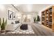 Bright living room with a couch, decorations, and a bookshelf at 7920 E Camelback Rd # 408, Scottsdale, AZ 85251