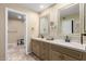 Dual vanity bathroom with decorative mirrors and plenty of counter space at 8082 E Via Del Vencino --, Scottsdale, AZ 85258
