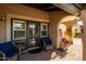Charming front porch with comfortable seating and attractive landscaping at 8082 E Via Del Vencino --, Scottsdale, AZ 85258