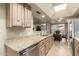 The kitchen features granite countertops, a stainless steel dishwasher, and a skylight at 8082 E Via Del Vencino --, Scottsdale, AZ 85258