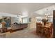 Spacious living room with a stone fireplace and an open floor plan flowing into the dining area at 8082 E Via Del Vencino --, Scottsdale, AZ 85258