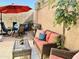 Outdoor patio features a dining set, seating area, grill, and neutral color pavers, perfect for entertaining and relaxing at 8082 E Via Del Vencino --, Scottsdale, AZ 85258