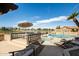 Community pool, spa, and seating area overlooking a golf course at 8082 E Via Del Vencino --, Scottsdale, AZ 85258