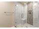 Sleek glass shower with marble tile and a built-in bench at 8082 E Via Del Vencino --, Scottsdale, AZ 85258