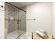 Walk-in shower with stone tile and a built-in niche at 8082 E Via Del Vencino --, Scottsdale, AZ 85258