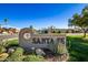 Welcoming Santa Fe community sign with lush landscaping at 8082 E Via Del Vencino --, Scottsdale, AZ 85258