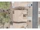 Overhead view of a neighborhood with tan homes, desert landscaping, and a nearby street at 8096 E Lavender Dr, Gold Canyon, AZ 85118