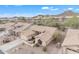 Desert community featuring tan homes, native plants, and scenic mountain views at 8096 E Lavender Dr, Gold Canyon, AZ 85118